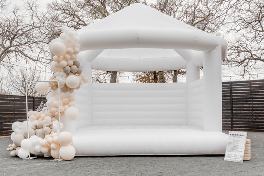 Book a wedding white bounce house for your special day